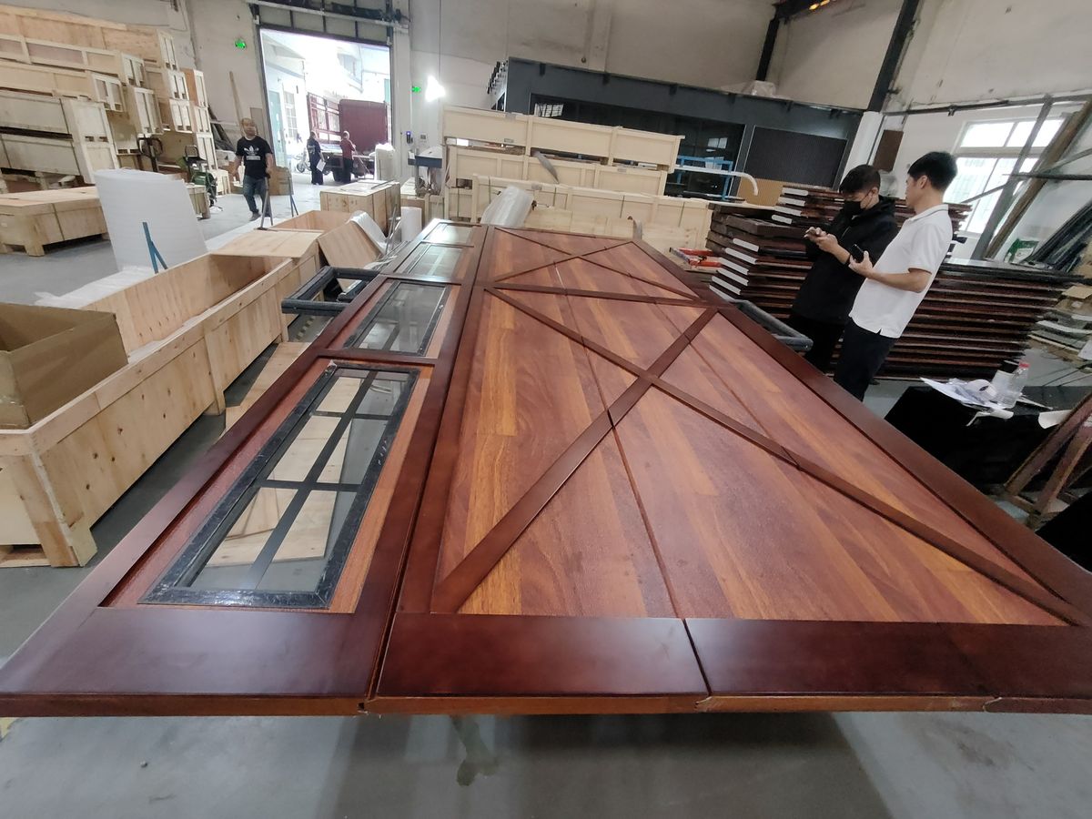 Factory assembly of carriage-house style garage door panels