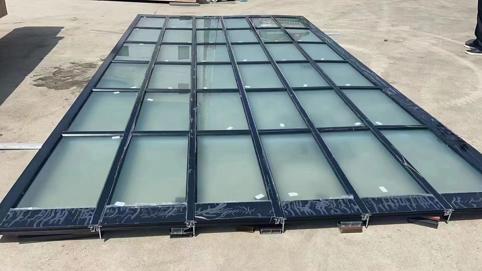 Black-framed full-view glass French-style garage door