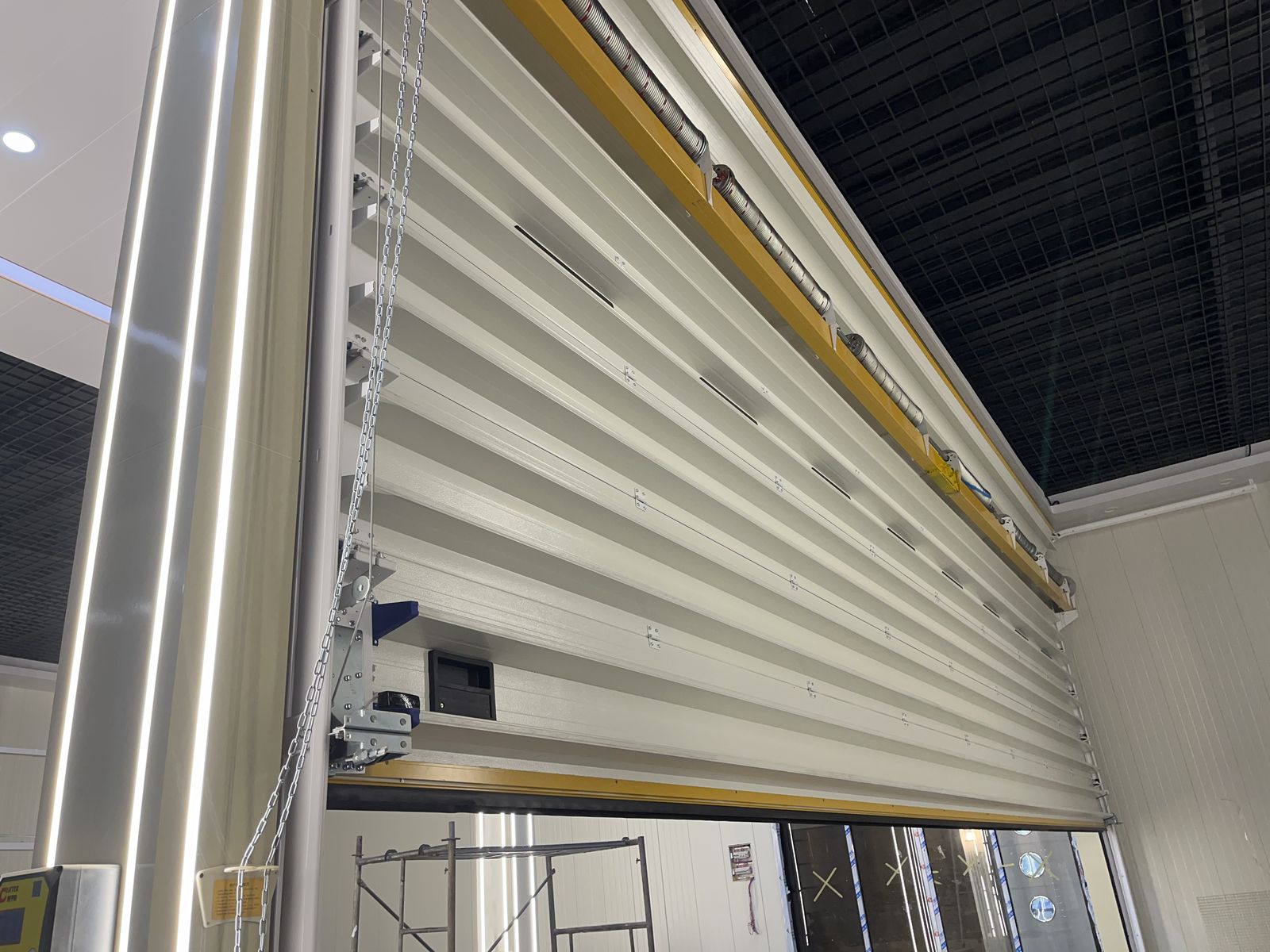 Roller shutter door installed in a commercial showroom — manufactured by Sunotech China